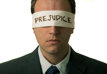 Blindfolded man with "prejudice" text on the blindfold